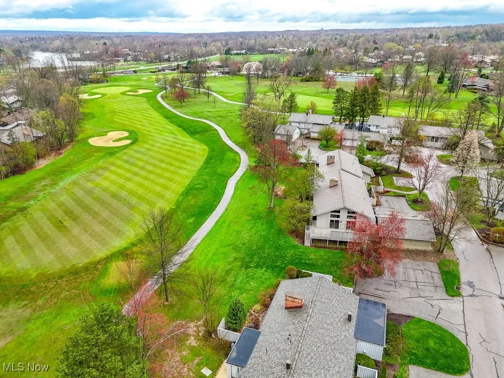 Drone / aerial view featuring golf course view and a residential view
