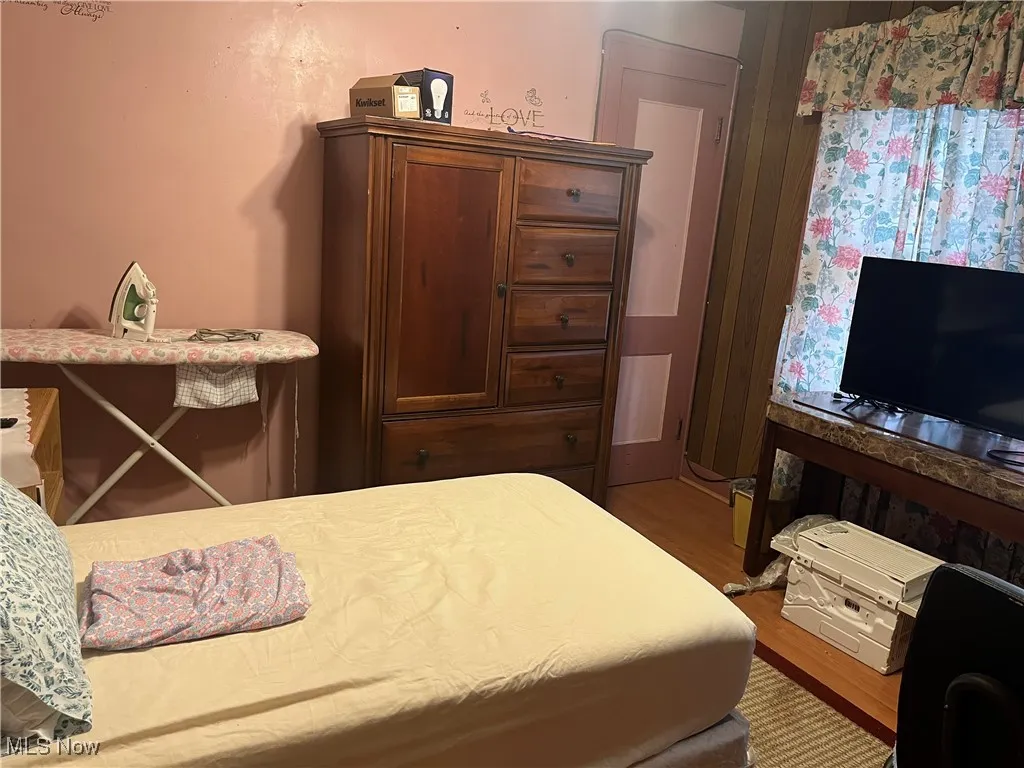 Bedroom featuring wood finished floors