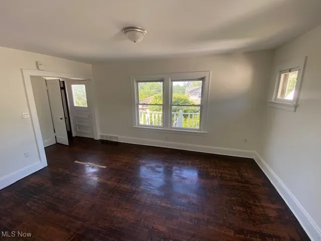 Empty room featuring wood finished floors