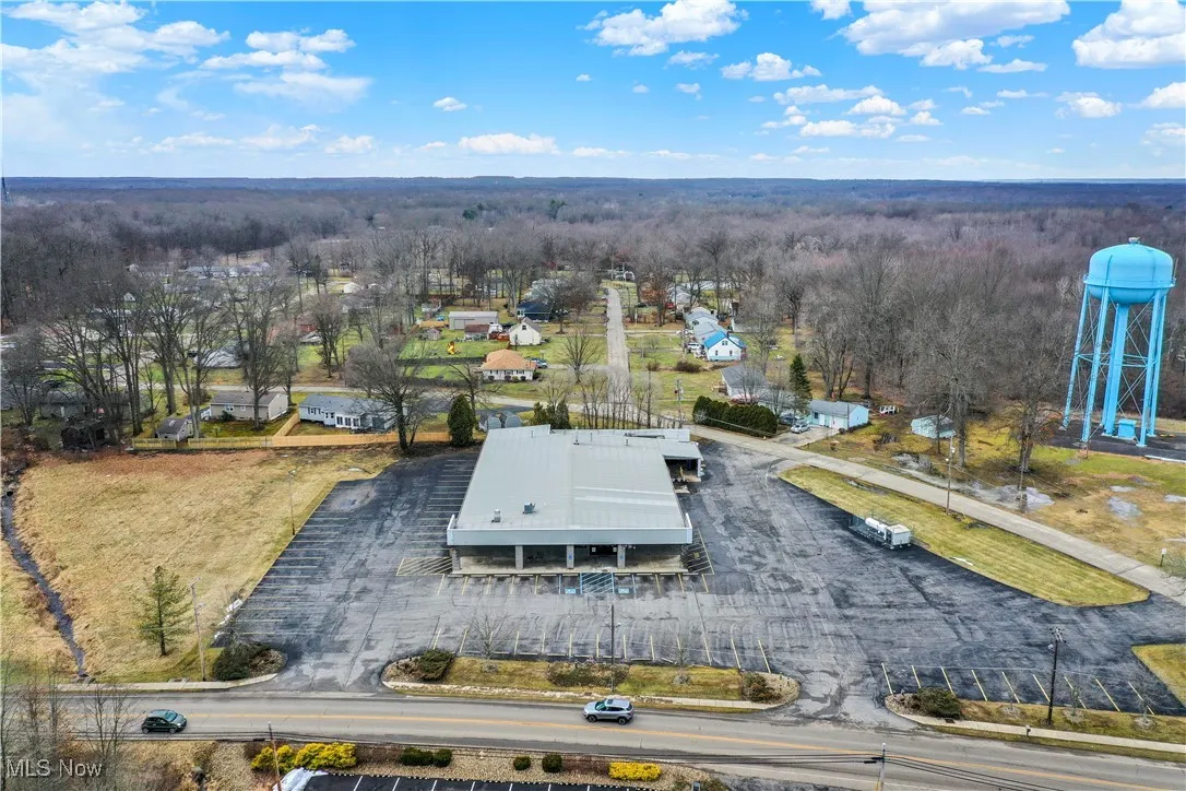 Aerial view featuring a view of trees