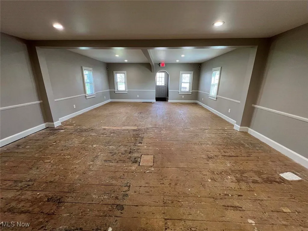 Spare room with baseboards and recessed lighting