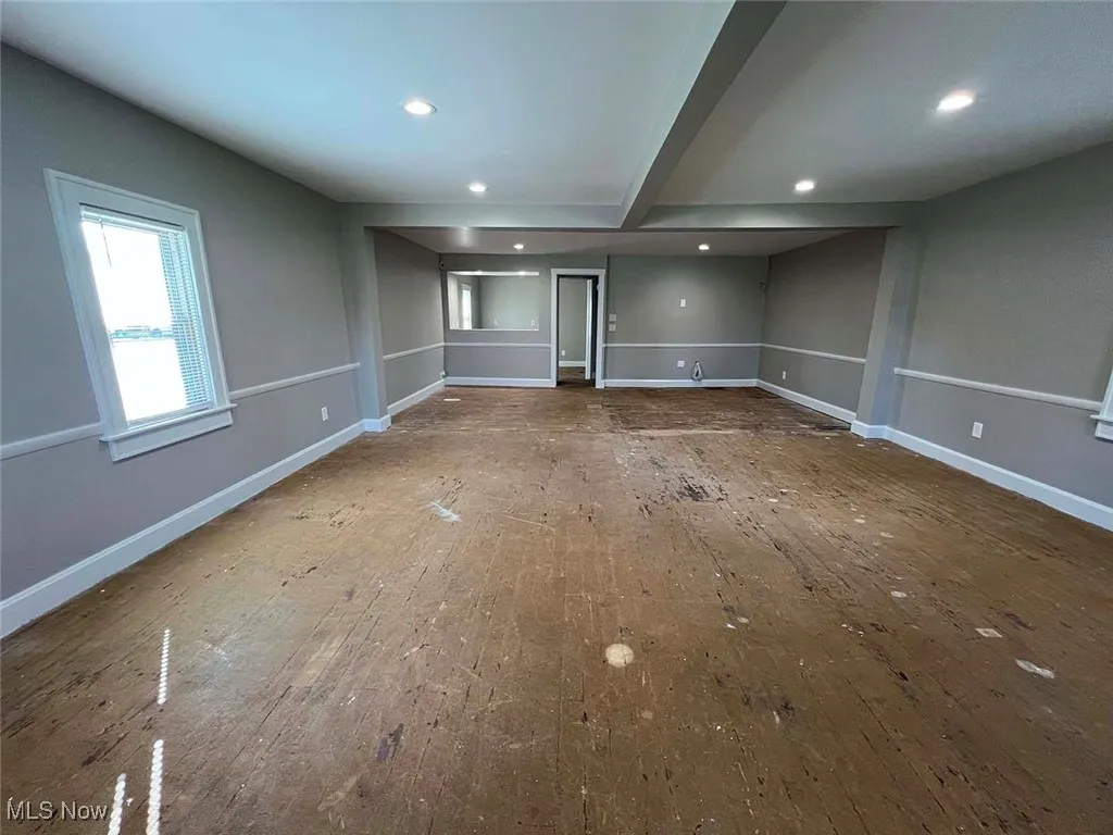 Empty room with recessed lighting, hardwood / wood-style floors, and baseboards