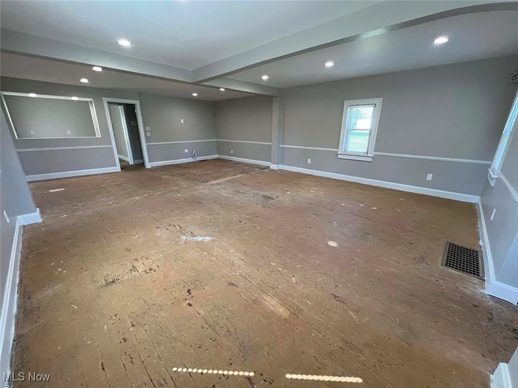 Empty room with recessed lighting, hardwood / wood-style floors, and baseboards