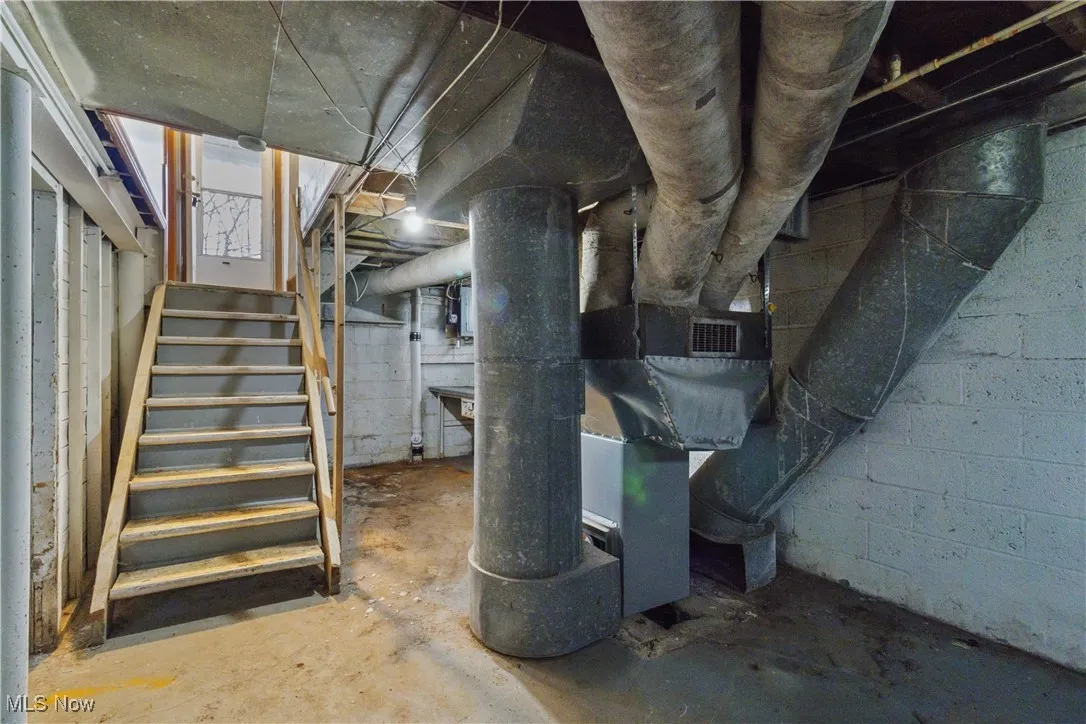 Unfinished basement with stairs