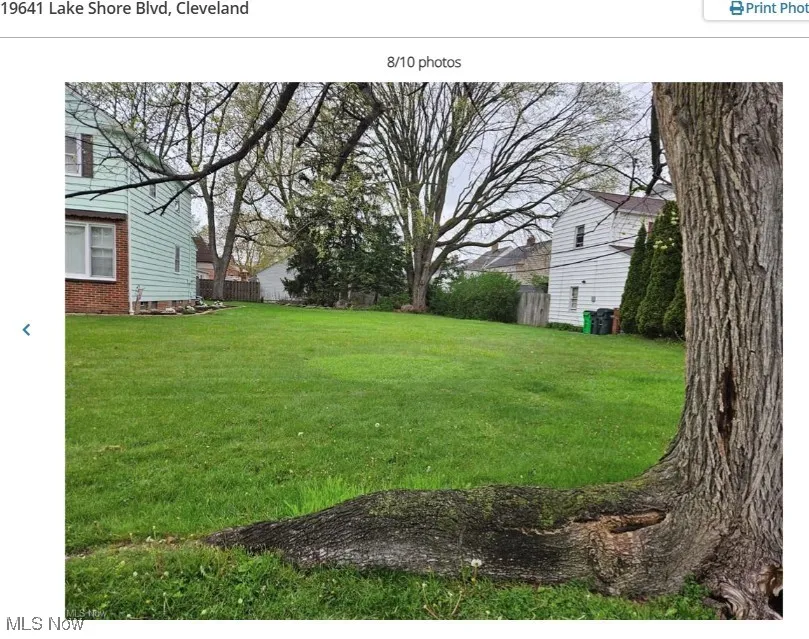 View of yard featuring fence