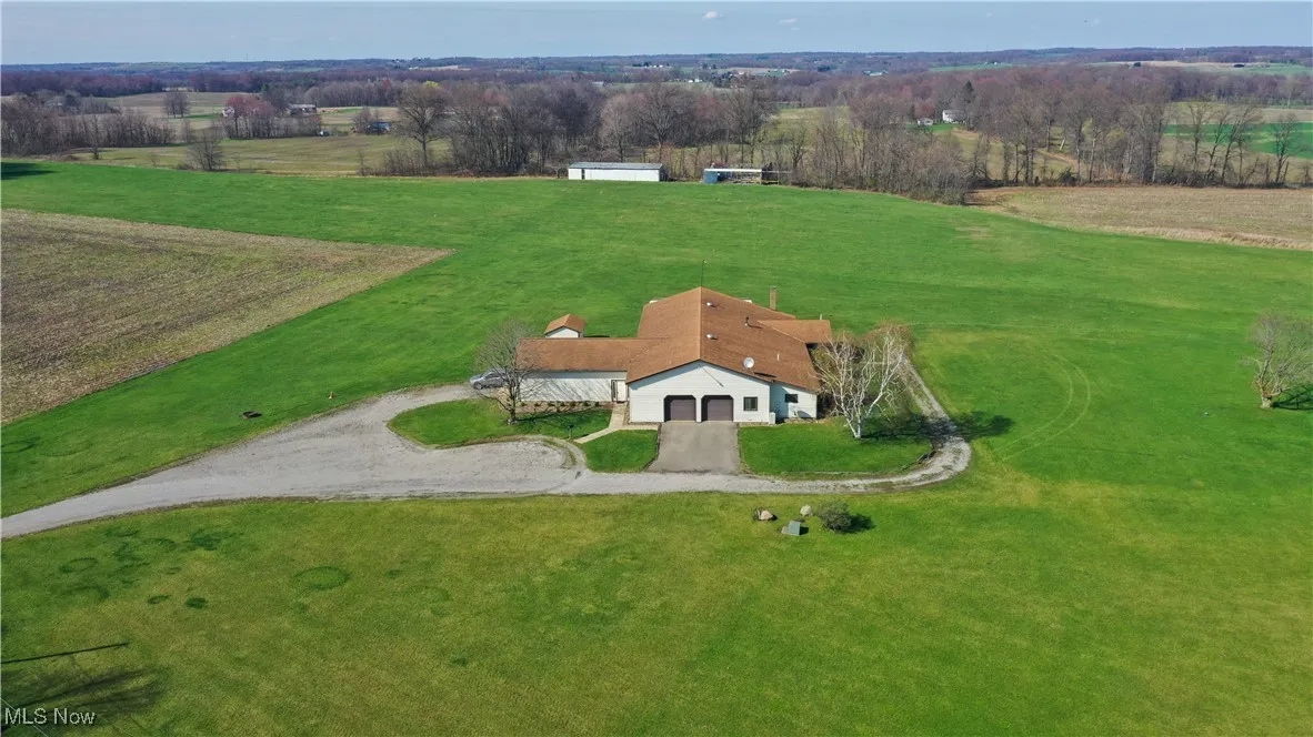 Birds eye view of property featuring a rural view