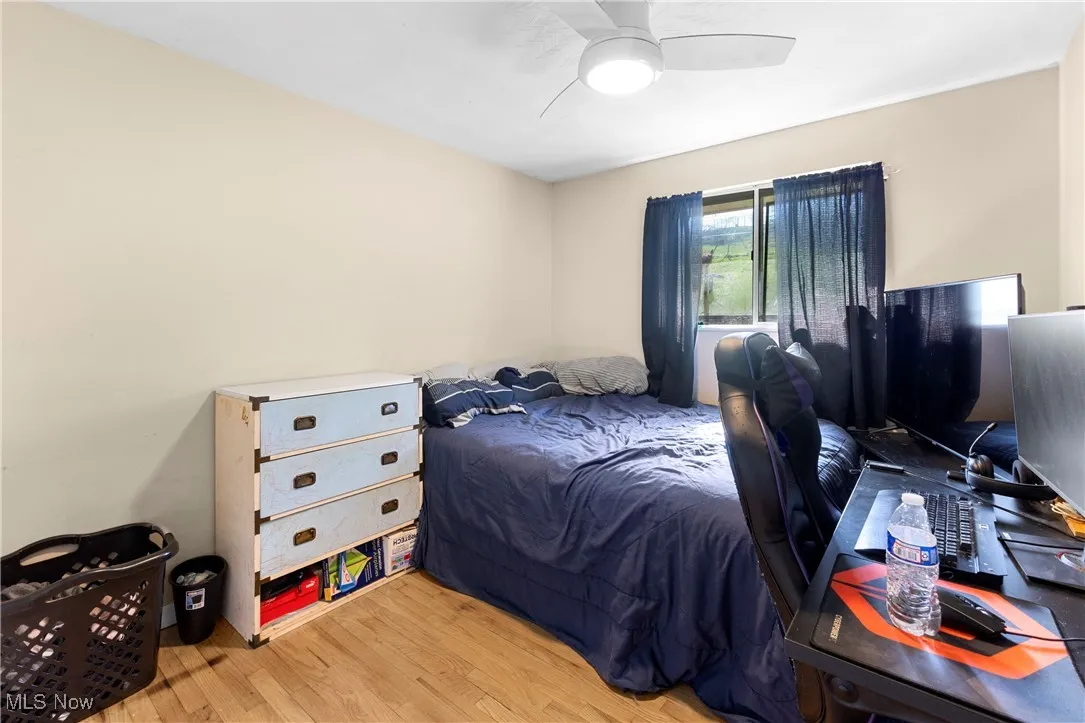 Bedroom featuring ceiling fan and light wood-style flooring