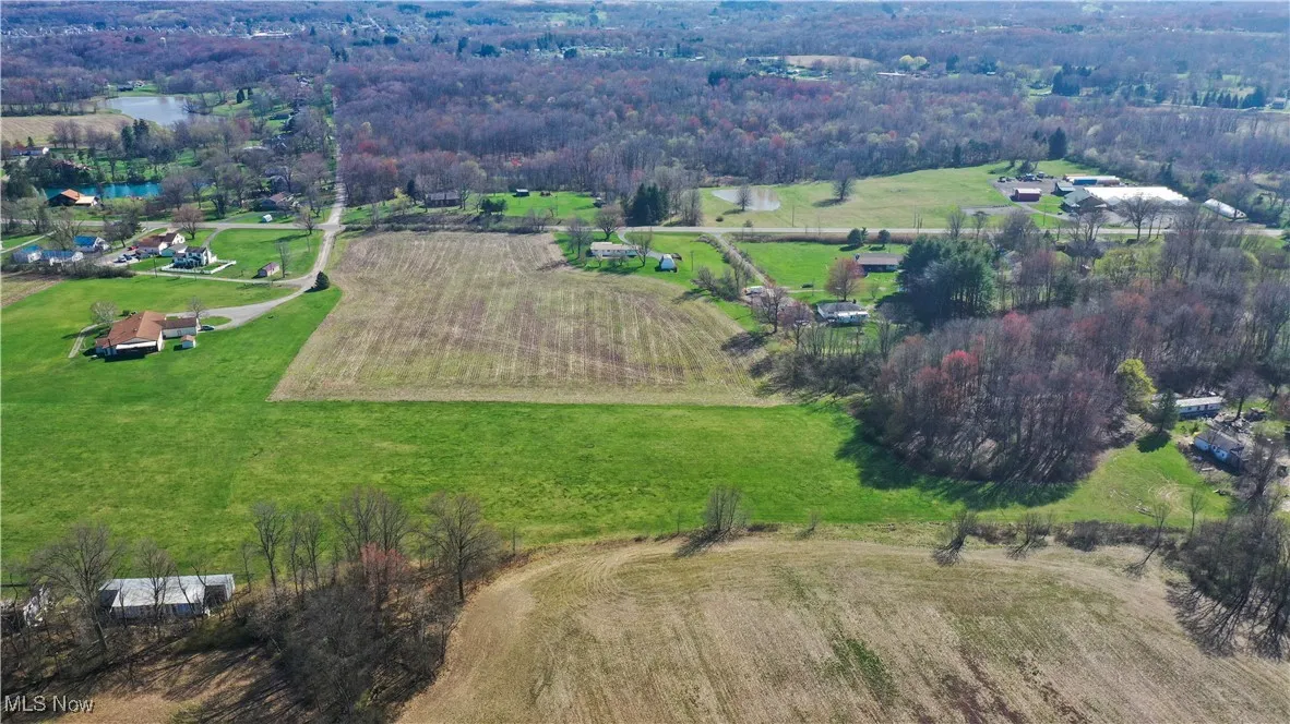 Birds eye view of property featuring a rural view