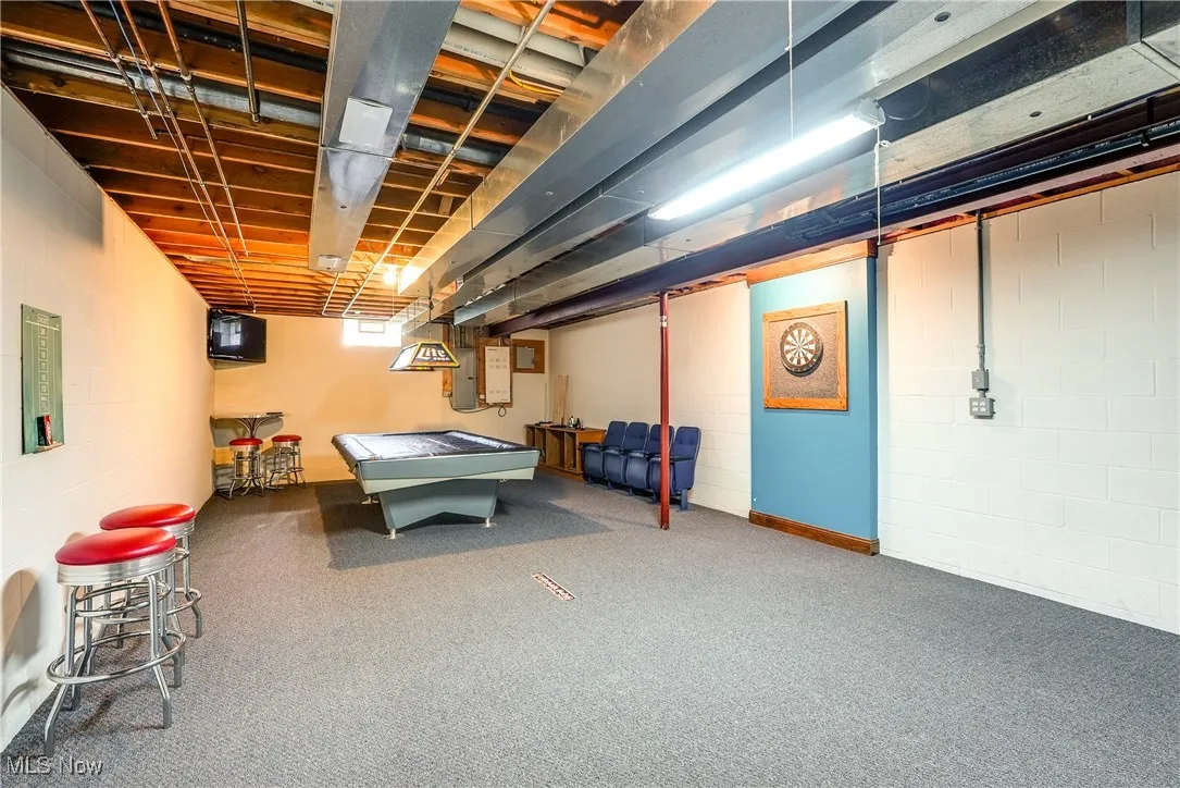 Game room area with carpet. Pool table will stay