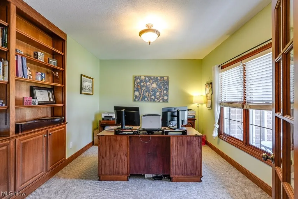 Spacious Office with Built-in bookcases and French doors