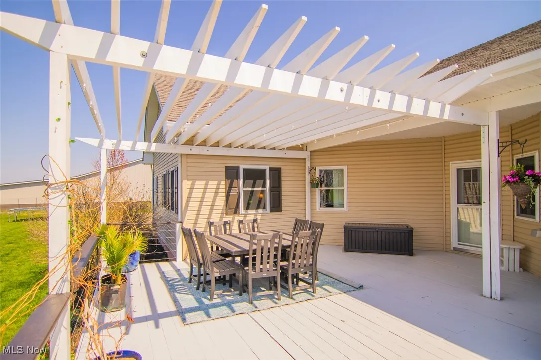 View of patio featuring outdoor dining space and a deck
