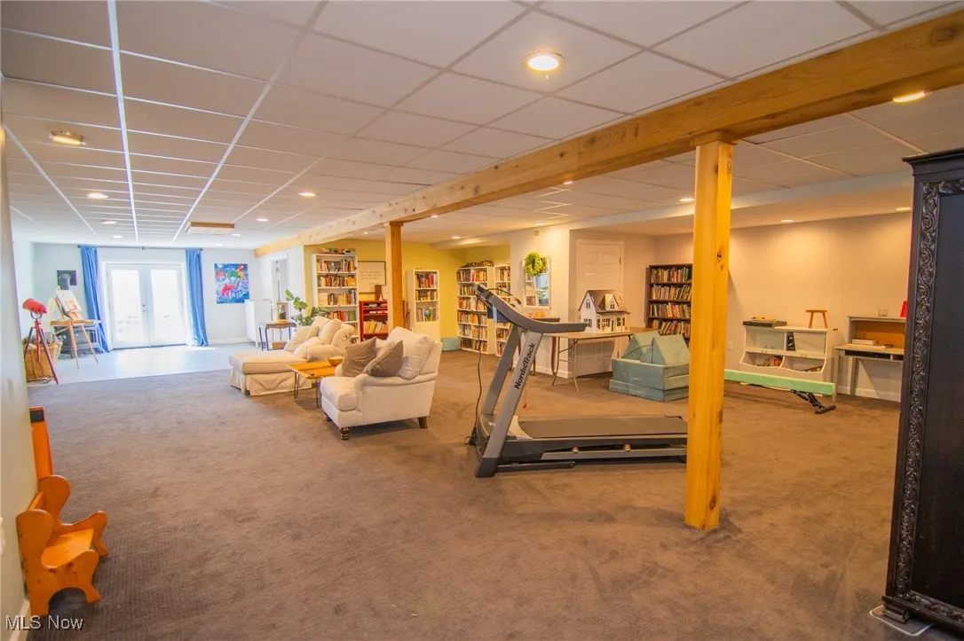 Workout area featuring recessed lighting, carpet floors, and a drop ceiling