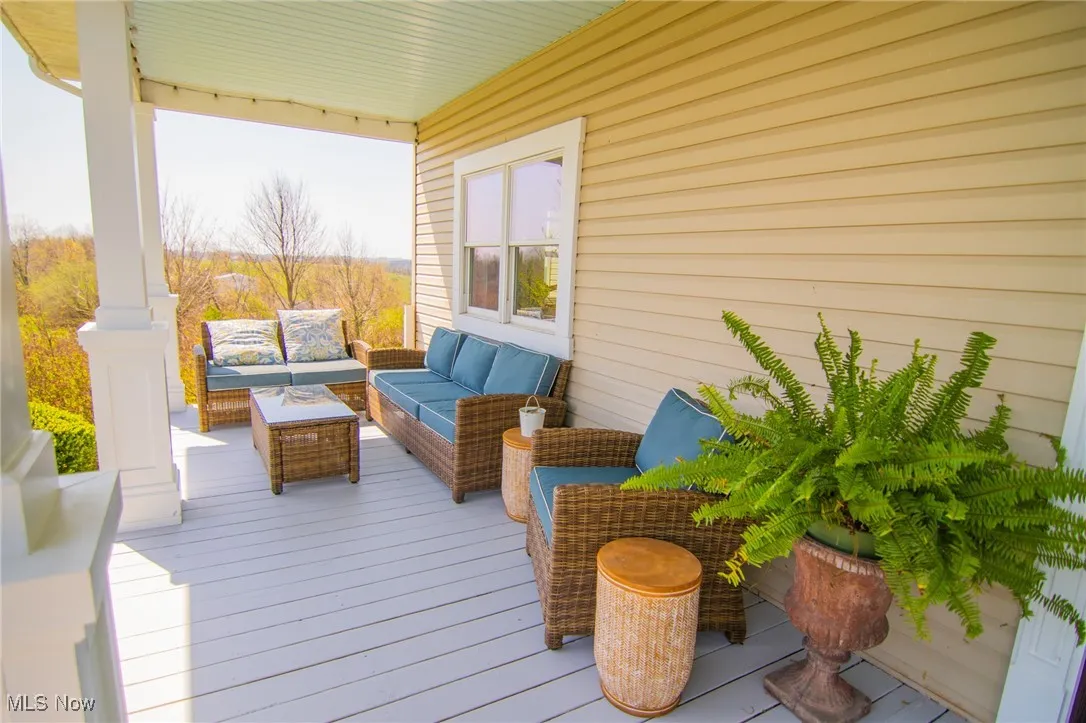 Wooden terrace featuring an outdoor hangout area