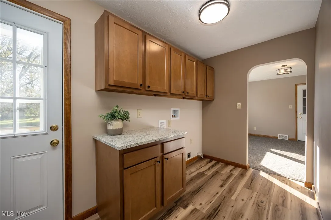 Laundry area with exit to back yard.