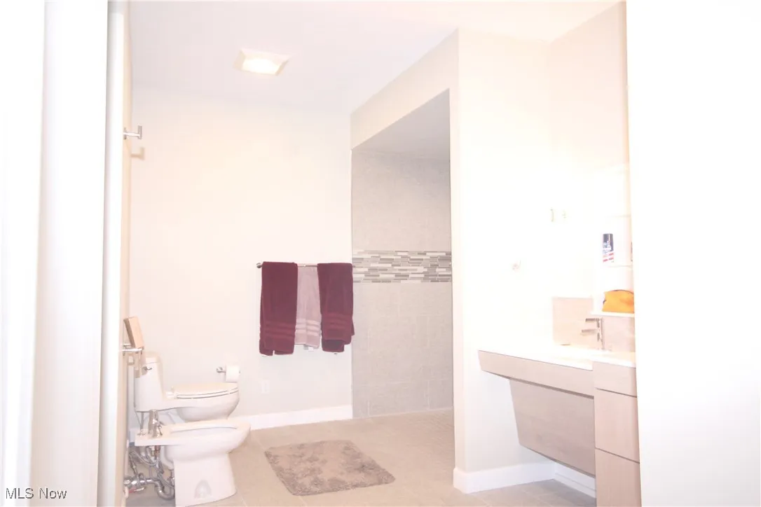 In-law suite with ADA compliant bathroom featuring a bidet