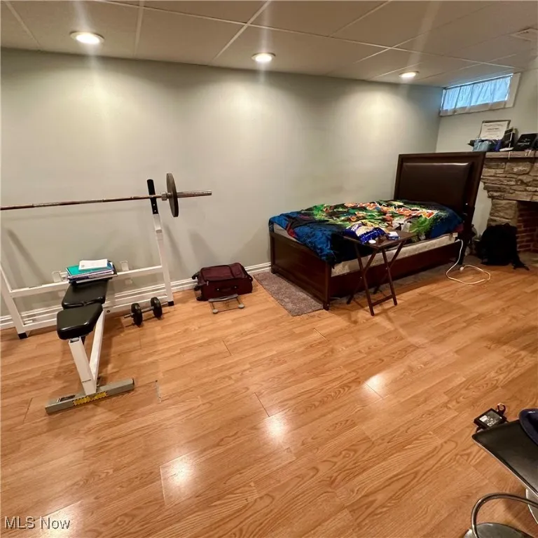 Basement featuring baseboards and wood finished floors