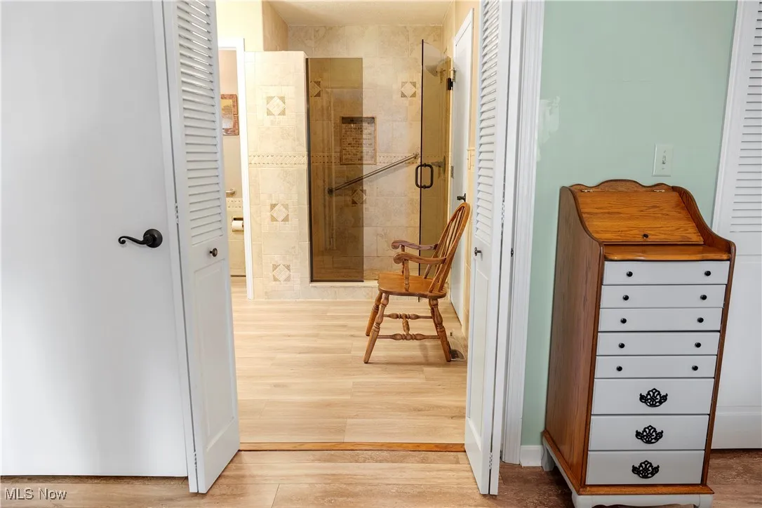 Hall featuring light wood finished floors