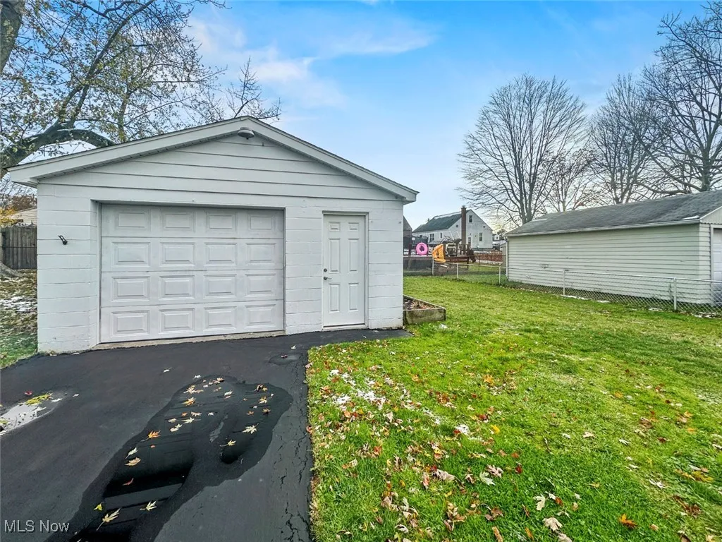 Detached garage featuring driveway