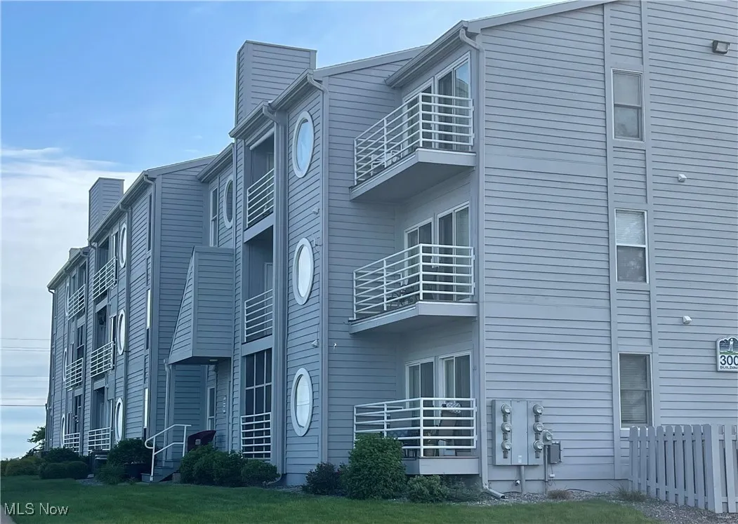 View of building exterior with fence