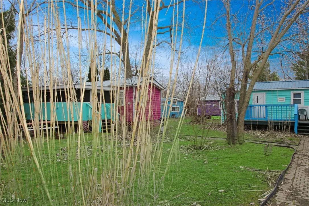 View of yard featuring a wooden deck