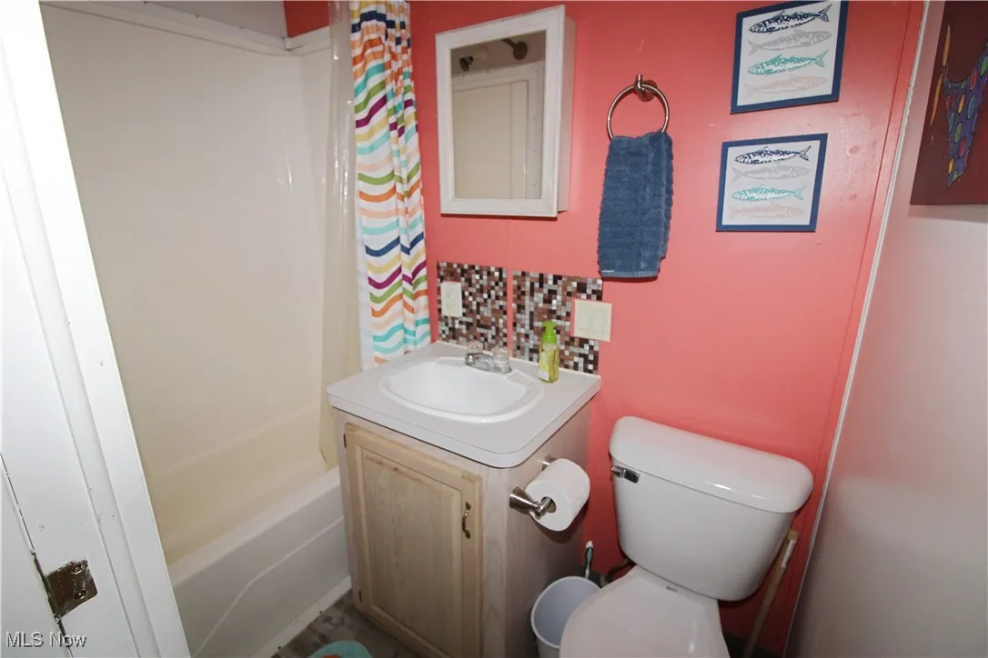Full bathroom featuring toilet and​​‌​​​​‌​​‌‌​‌‌​​​‌‌​‌​‌​‌​​​‌​​ vanity