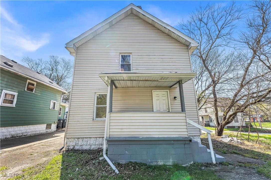 Back of house with covered porch