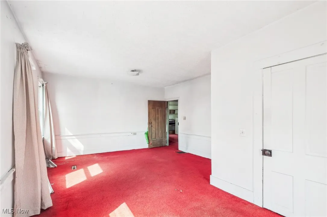 Unfurnished bedroom featuring carpet
