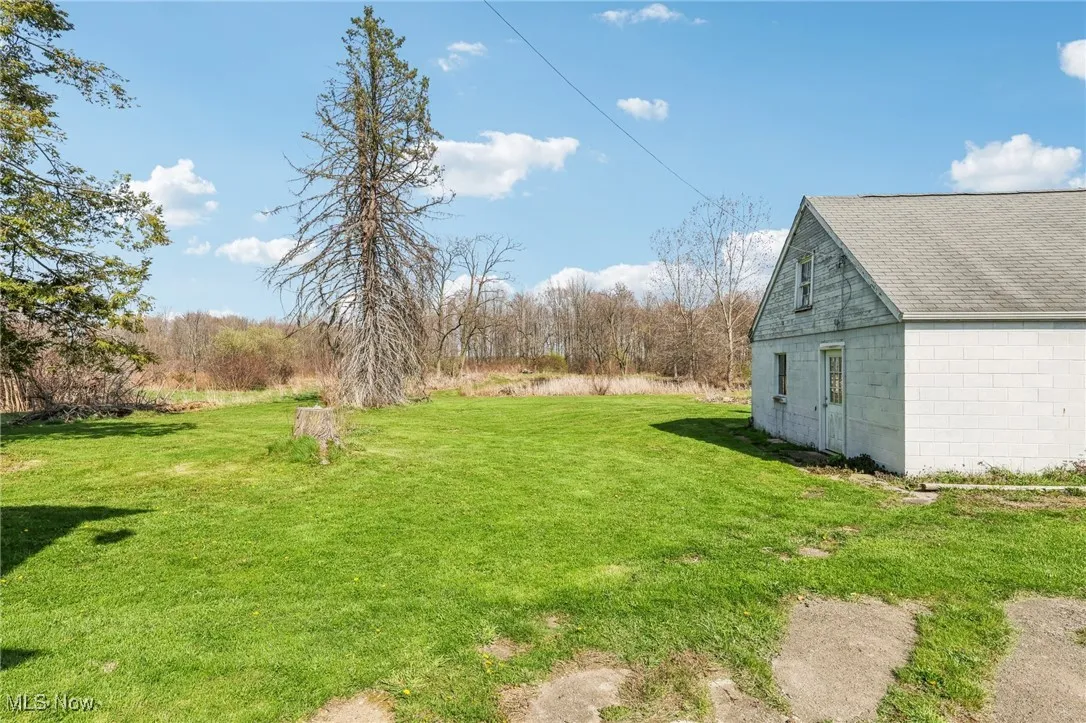 View of yard with an outbuilding