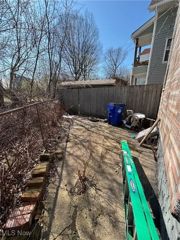 View of patio with fence