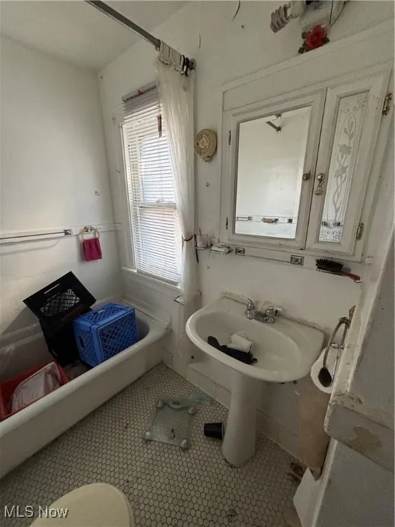Bathroom featuring tile patterned floors