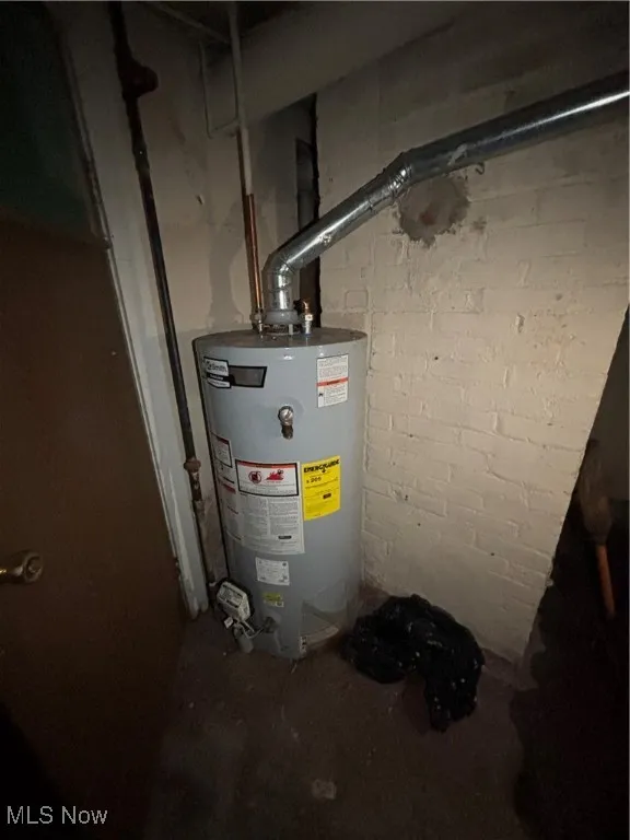 Utility room featuring gas water heater
