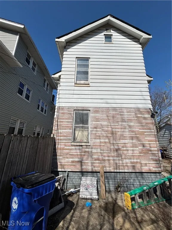 Back of property with fence