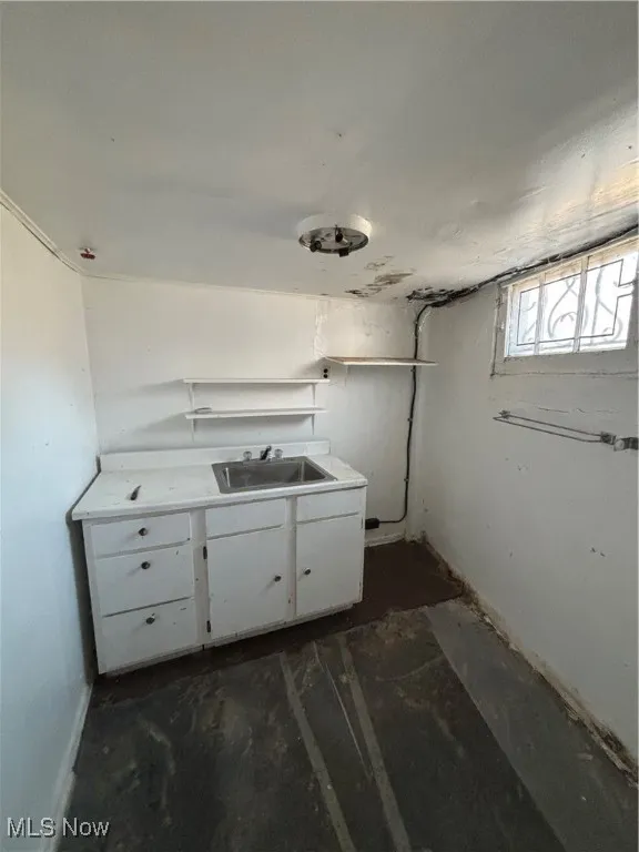 Laundry area with a sink