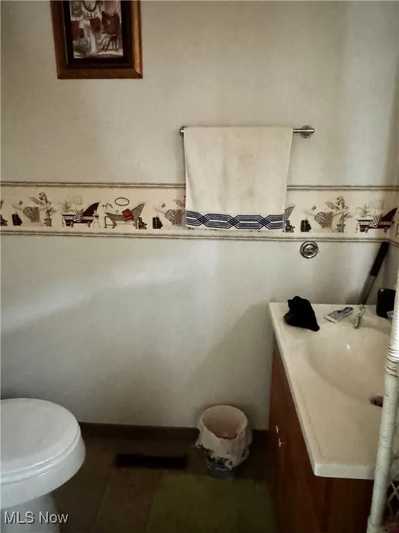 Bathroom featuring toilet and vanity