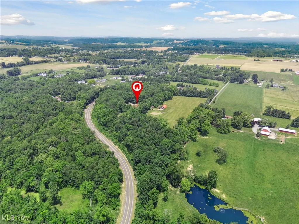 Aerial view of sparsely populated area with a nearby body of water