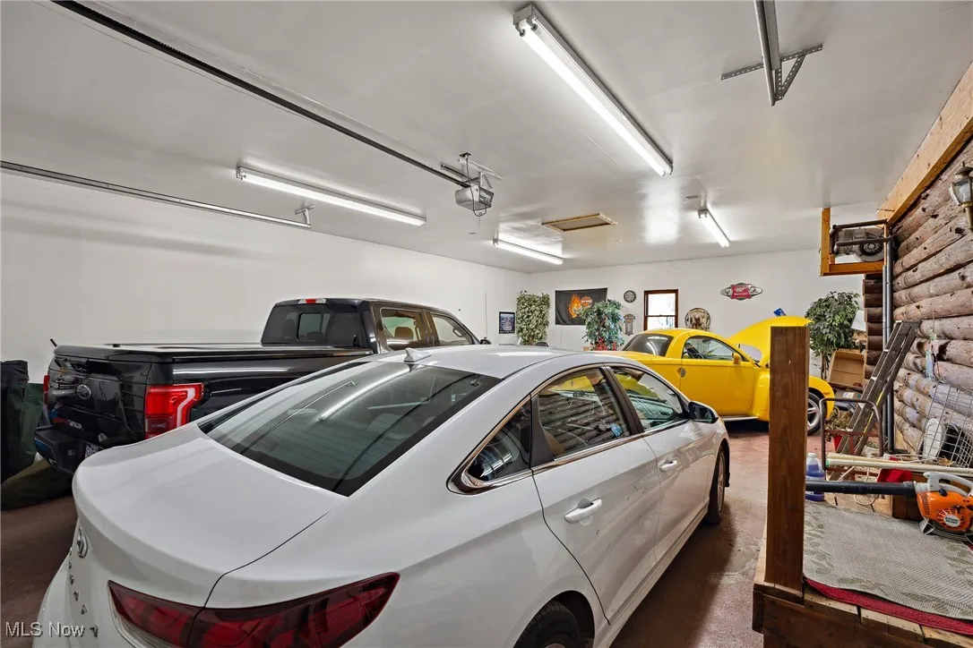 Garage featuring a garage door opener
