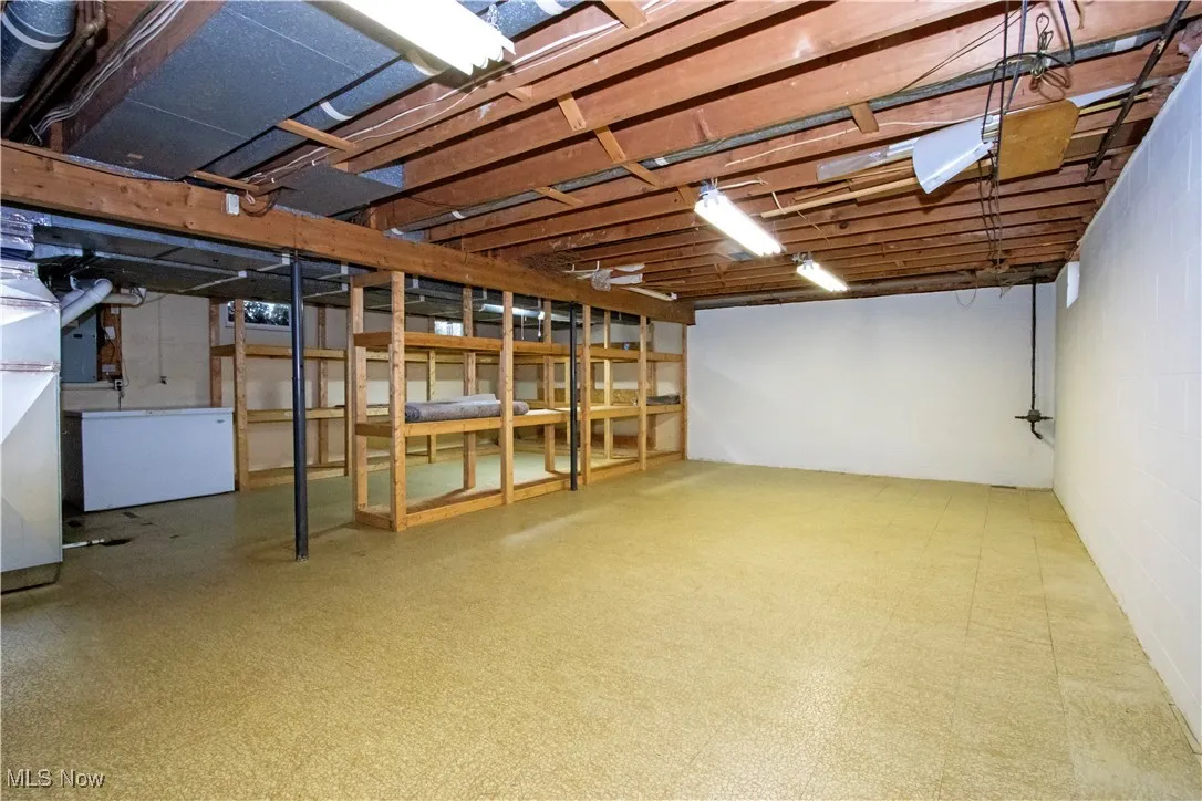Unfinished basement featuring tile patterned floors