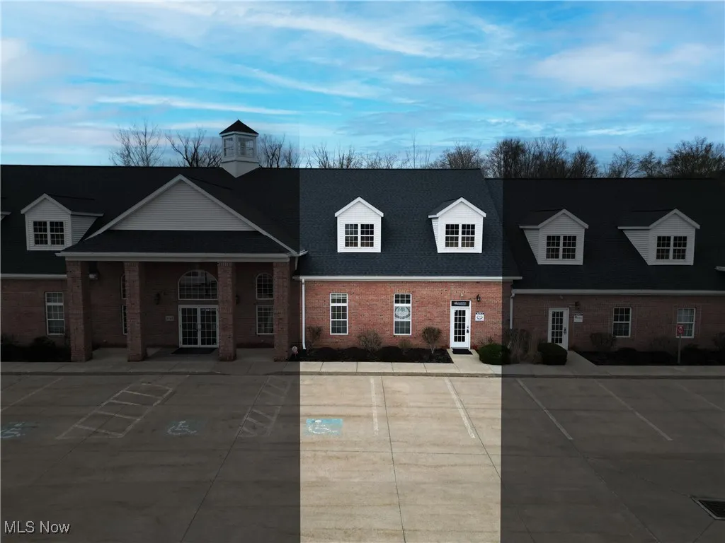 View of front of house with brick siding