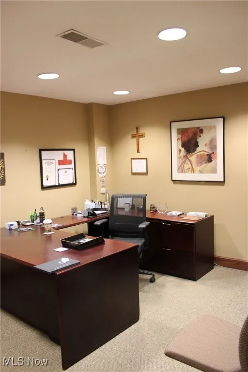 Office featuring visible vents, baseboards, carpet flooring, and recessed lighting