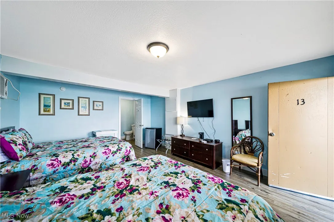 Bedroom featuring wood-type flooring