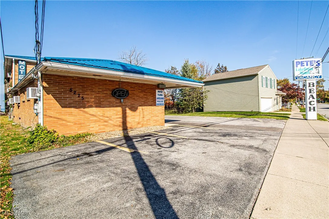View of property exterior featuring a garage