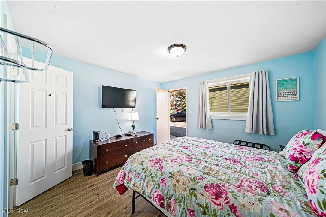 Bedroom featuring dark wood-type flooring