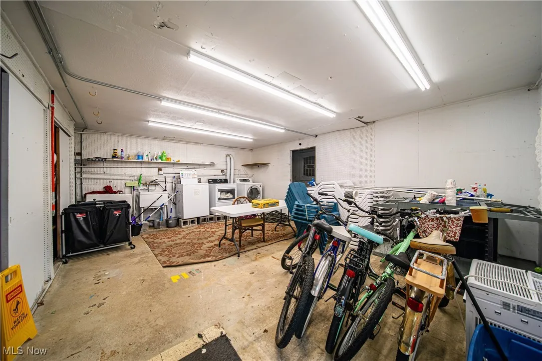 Garage featuring independent washer and dryer