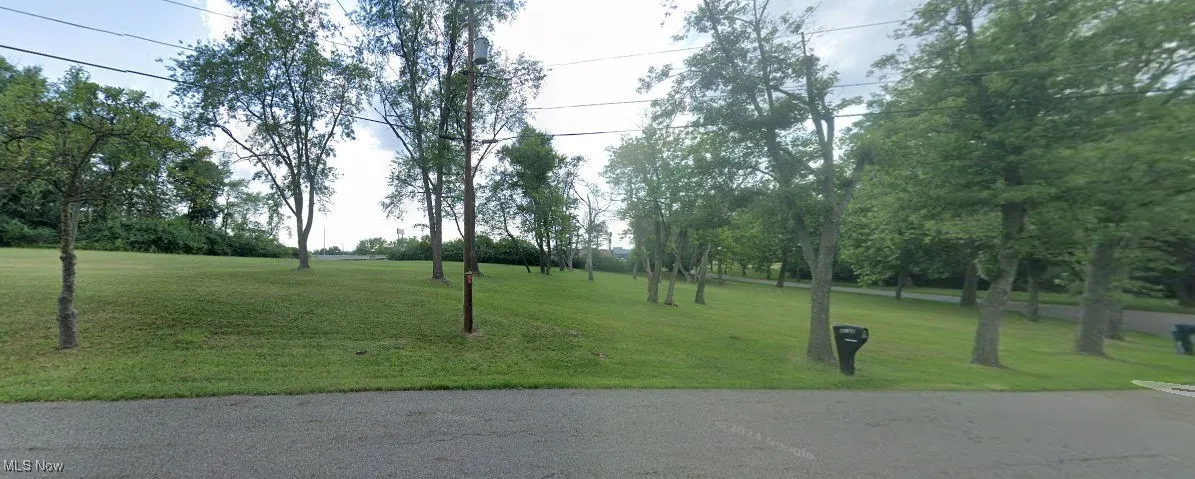 View of property's community featuring a lawn