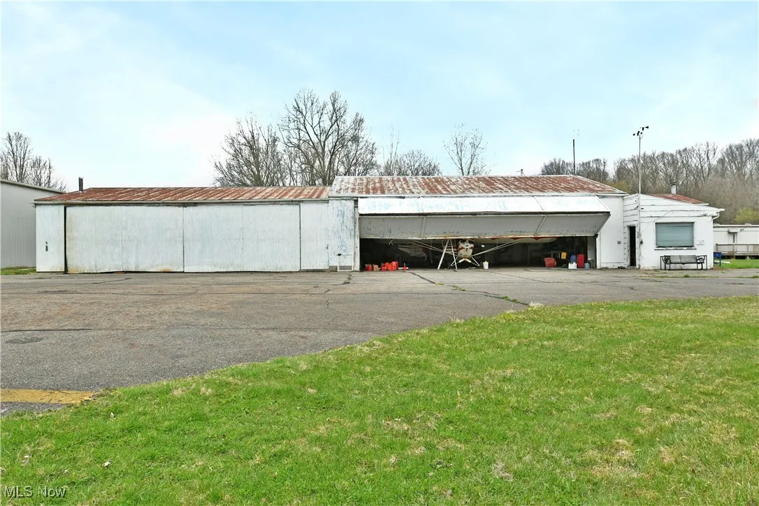 View of pole building featuring a lawn