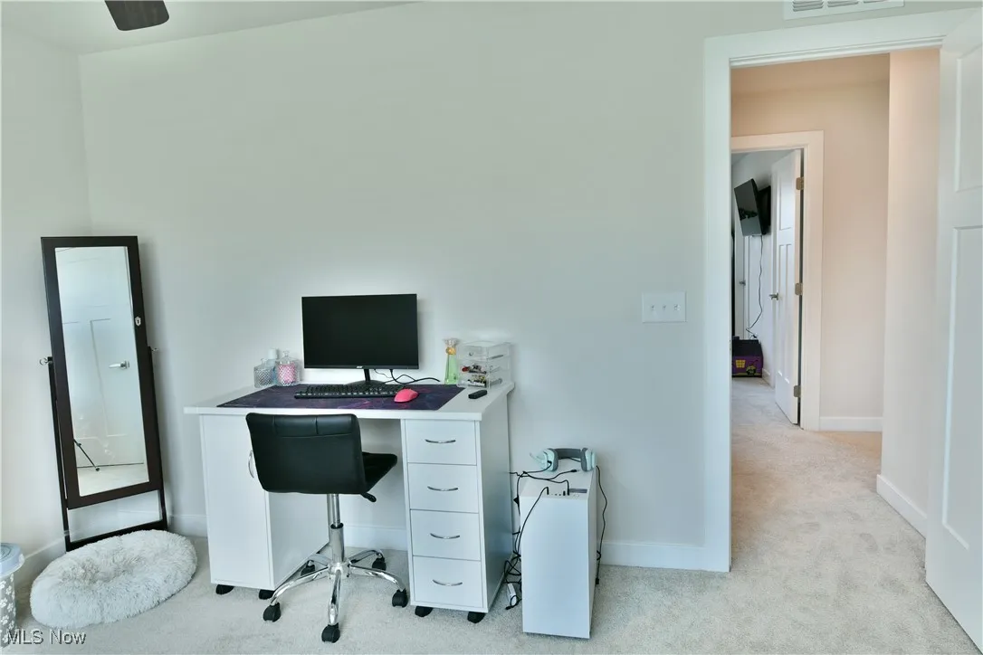 Bedroom with carpet, baseboards, and visible vents