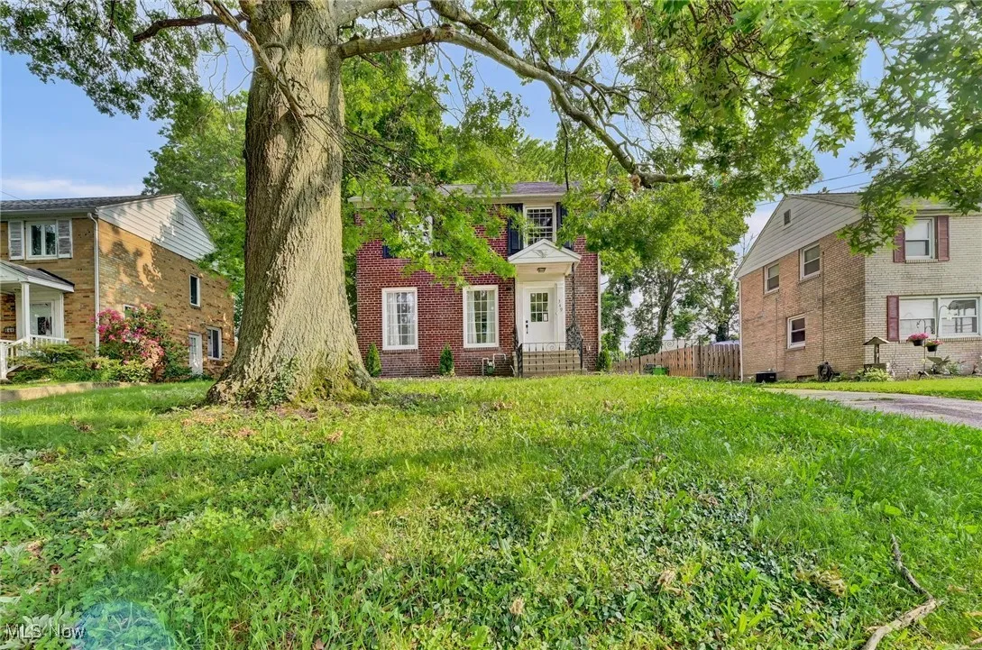 View of front of property featuring brick siding