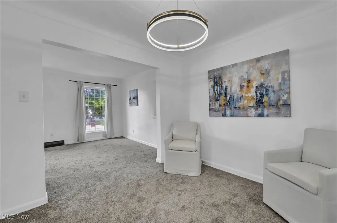 Dining area featuring carpet and baseboards