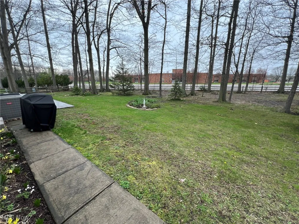 View of yard featuring fence
