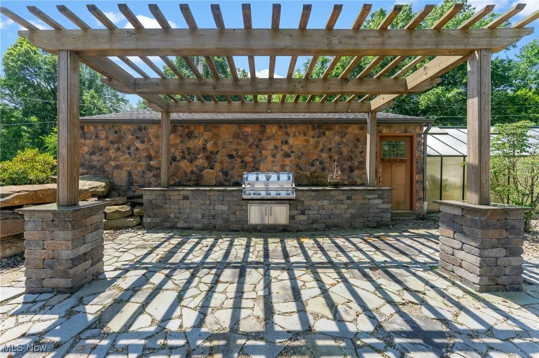 View of patio / terrace featuring area for grilling and a pergola